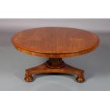 A 19TH CENTURY MAHOGANY TILT TOP TABLE, circular on a low set tapered hexagonal column, tripartite