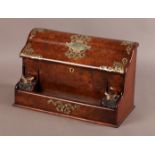 A VICTORIAN BURR WALNUT VENEERED DESK COMPENDIUM applied cut brass strapwork mounts, the hinged