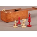 A CONTINENTAL BONE AND RED STAINED BONE CHESS SET, king 6cm high, boxed