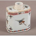 A CHINESE PORCELAIN TEA CADDY of canted rectangular form and cylindrical neck, polychrome