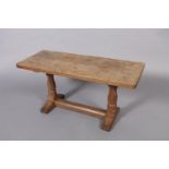 THOMPSON OF KILBURN 'MOUSEMAN' , an oak coffee table, the rectangular adzed surface on octagonal and