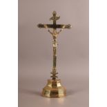 AN 18TH CENTURY BRASS CRUCIFIX, engraved at the terminals, applied banner, cast figure and skull,