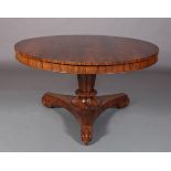 A REGENCY ROSEWOOD VENEERED CIRCULAR BREAKFAST TABLE, the well figured top with conforming deep