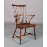 A 19TH CENTURY ASH AND ELM STICK BACK WINDSOR ARMCHAIR, having a bar top rail with upturned ears,