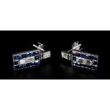 A PAIR OF ART DECO SAPPHIRE AND DIAMOND EARRINGS in 18ct white gold, each pave set with two baguette