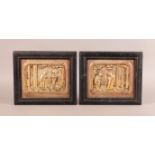 A PAIR OF CHINESE GILDED WOODEN RELIEF CARVED PANELS of figures within fenced building, gilt sand