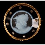 A VICTORIAN ONYX CAMEO AND DIAMOND SHIELD BROOCH in 9ct gold, the circular portrait of Agamemno with