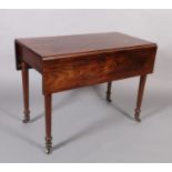 A FIGURED MAHOGANY PEMBROKE TABLE IN THE MANNER OF GILLOWS, pair of folding leaves, the frieze