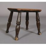 AN EARLY 19TH CENTURY ELM STOOL, the chamfered rectangular top on simple turned legs, 31cm long x