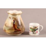 A ROYAL WORCESTER VASE painted with a pheasant, signed Jas. Stinton, on a blush ivory ground,