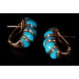 A PAIR OF TURQUOISE EARRINGS each channel set inline with five tapered cabochon stones, pierced