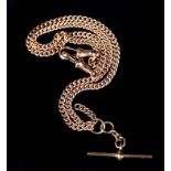 A GEORGE V DOUBLE WATCH CHAIN in 9ct rose gold curb links with T bar and swivel fasteners,