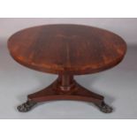 A MID 19TH CENTURY ROSEWOOD TILT TOP BREAKFAST TABLE, circular, having a tapered and rounded