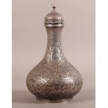 A PERSIAN SILVER COLOURED METAL SQUAT BALUSTER VASE AND COVER, decorated overall with scrolling