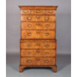 AN 18TH CENTURY FIGURED WALNUT CHEST ON CHEST, inlaid in satinwood and herringbone banded, having