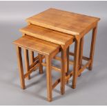 ALAN GRAINGER OF BRANSBY 'ACORN MAN', A NEST OF THREE ENGLISH OAK OCCASIONAL TABLES, rectangular, on