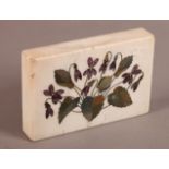 A 19TH CENTURY WHITE MARBLE DESK WEIGHT inlaid in blue john and green hardstone with violets and