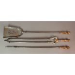 A SET OF THREE VICTORIAN FIRE IRONS with copper spiral cast baluster and ball terminals
