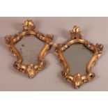 A PAIR OF LATE 19TH CENTURY GILTWOOD MIRRORS in rococo style with girandole brackets (fittings