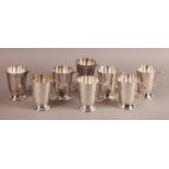 A SET OF EIGHT SILVER PLATED HALF PINT TANKARDS of plain form, all inscribed 'New Inn, Mansfield'