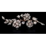 A VICTORIAN DIAMOND FLORAL SPRAY BROOCH in 9ct gold and silver all over set with rose and Old