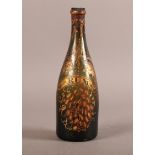A RARE 18TH CENTURY GREEN GLASS BOTTLE of tapered form with deep punt, the body finely decorated