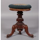A VICTORIAN MAHOGANY REVOLVING PIANO STOOL, the circular stuffed over top with floral petit point