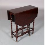 AN EDWARD VII 'PLUM PUDDING' MAHOGANY OCCASIONAL GATELEG TABLE, having twin shaped oval drop leaves,