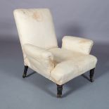 AN VICTORIAN UPHOLSTERED ARMCHAIR, turned ebonised legs, fitted brass castors, front 70cm wide x