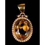 A 19TH CENTURY EDWARD VII CITRINE AND SEED PEARL PENDANT by Murrle Bennet & Co in 9ct gold, claw set