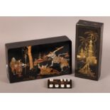 A JAPANESE BLACK LACQUERED BOX of rectangular form, c.1900, decorated with Samurai, 25cm wide,