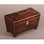 AN EARLY 19TH CENTURY MAHOGANY SARCOPHAGUS TEA CADDY inlaid with boxwood stringing, the interior