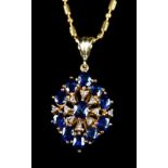 A SAPPHIRE AND DIAMOND CLUSTER PENDANT, the oval faceted sapphire and small eight cut diamonds