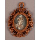 A NORTH INDIAN OVAL MINIATURE ON IVORY OF A RULER c.1860 in a carved wood frame, 6cm high x 4.5cm