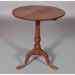 A GEORGE III OAK AND ELM SNAP TOP TRIPOD TABLE, the circular top above a baluster column, three