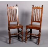 A PAIR OF LATE 17TH CENTURY OAK RAIL BACK CHAIRS with shaped cresting rail flanked by a pair of