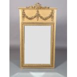 A FRENCH GILTWOOD AND GESSO WALL MIRROR, rectangular, with ribboned crest, above a panel with floral