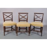 A SET OF THREE EARLY 19TH CENTURY SINGLE CHAIRS, having a reeded frame with X back, upholstered