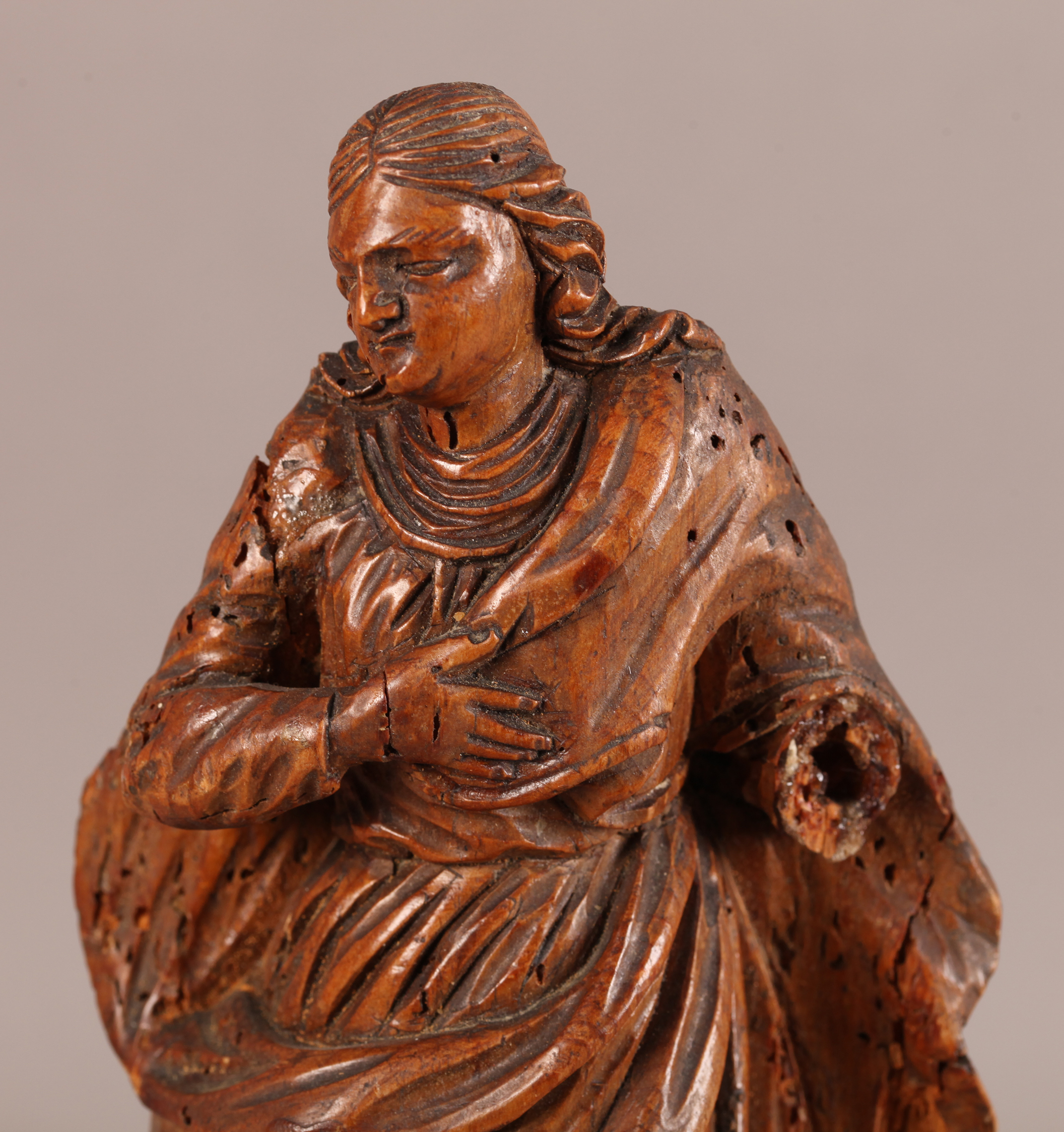 A 17TH CENTURY CARVED PINE FIGURE OF A SAINT with billowing cloak, his right arm across his chest, a - Image 2 of 2