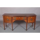 A GEORGE III MAHOGANY BOW FRONT SIDEBOARD, the top with reeded lip above one long and two deep