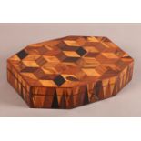 A REGENCY PARQUETRY GAMES BOX of elongated octagonal form, veneered in exotic specimen woods in