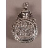 A VICTORIAN SILVER PERFUME FLASK, circular, embossed with opposing sprays of fruit and flowers