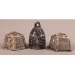 A SILVER COLOURED METAL MODEL OF A TEMPLE BELL cast with dragons beneath panelled beaded upper