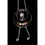 AN ART NOUVEAU PENDANT BY CHARLES HORNER in silver, collet set with a blister pearl within a pierced