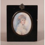 ENGLISH SCHOOL EARLY 19TH CENTURY portrait of a young woman, bust length, her hair dressed with a