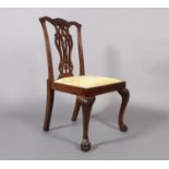 A MAHOGANY SINGLE CHAIR IN GEORGE III STYLE, the serpentine top rail foliate and pendant carved