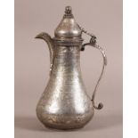A PERSIAN SILVER COLOURED METAL EWER OR LIDDED POT engraved overall with bands of figures, animals