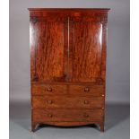 A 19TH CENTURY MAHOGANY CLOTHES PRESS, having a moulded cornice above two indented panel doors,