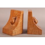 THOMPSON OF KILBURN 'MOUSEMAN' a pair of English oak bookends, each carved in relief with a mouse,