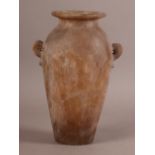 AN ALABASTER TWO HANDLED CANOPIC VASE of tapered baluster form, pair of rudimentary pierced handles,